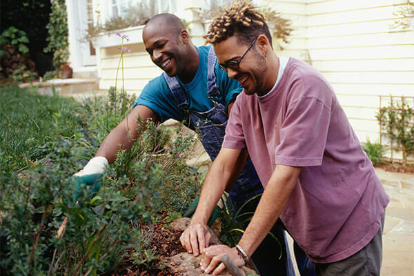 Gay couple gardening