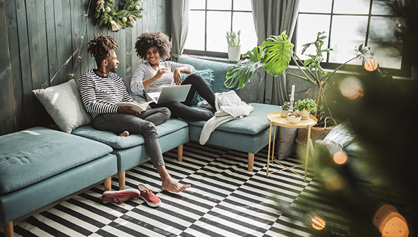 Couple relaxes in their new living room.