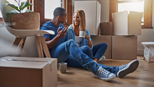 couple taking a break from unpacking in their new home