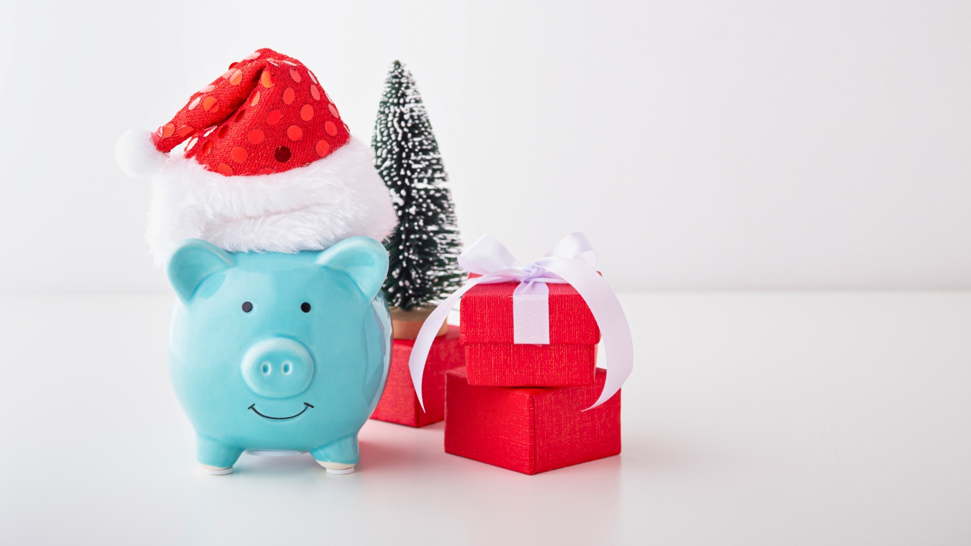 a piggy bank wearing a santa hat