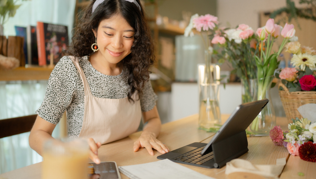 woman small business owner working at flower shop